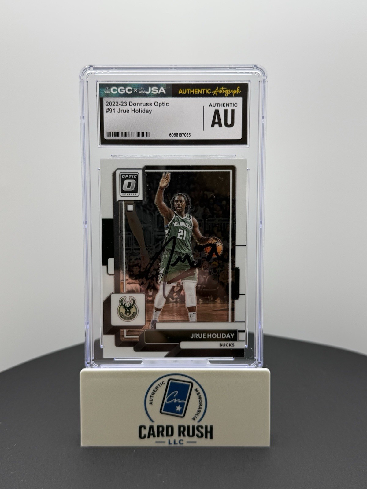 2022-23 Donruss Optic Jrue Holiday In-Person Autograph CGC/JSA Authentic, front