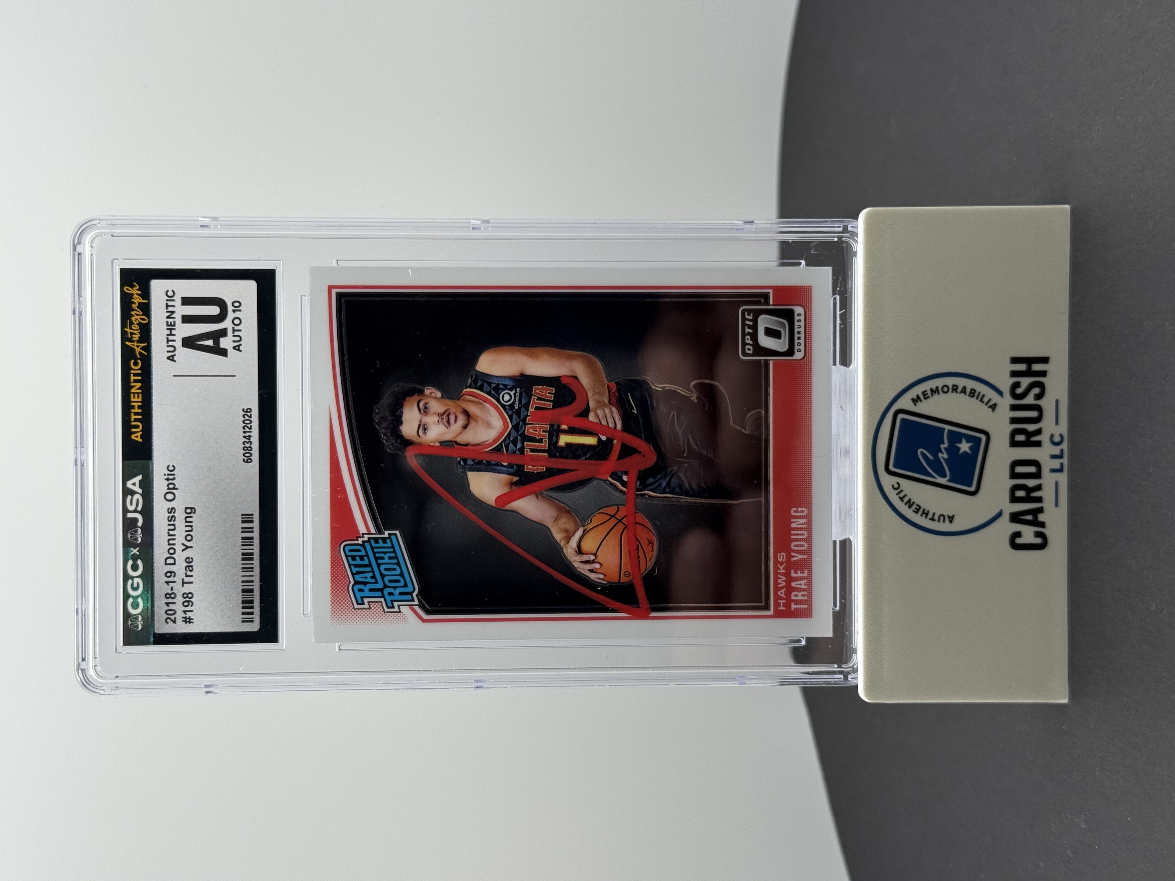 2018-19 Panini Donruss Optic Rated Rookie Trae Young RC IP Auto 10 CGC/JSA, front