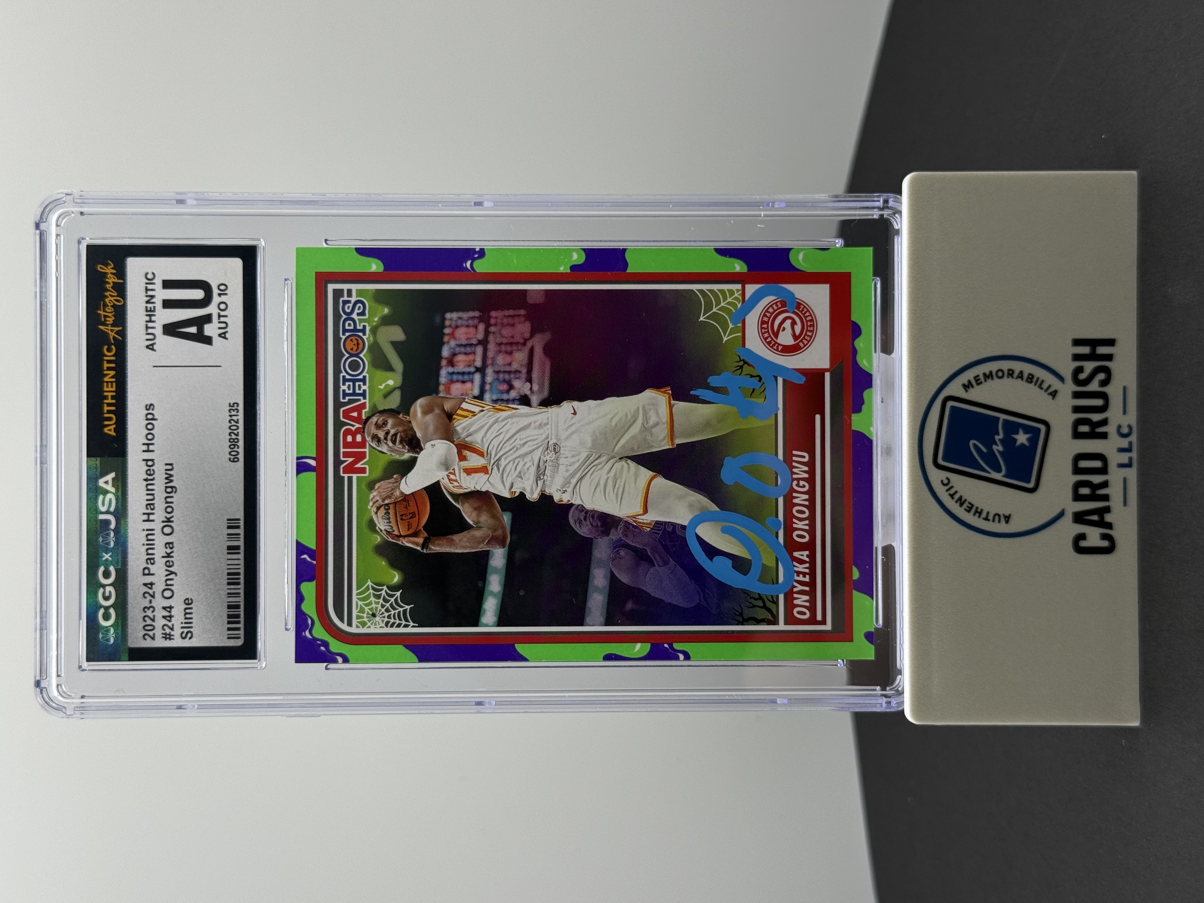 2023-24 Panini NBA Haunted Hoops Green Slime Onyeka Okongwu IP Autograph, front