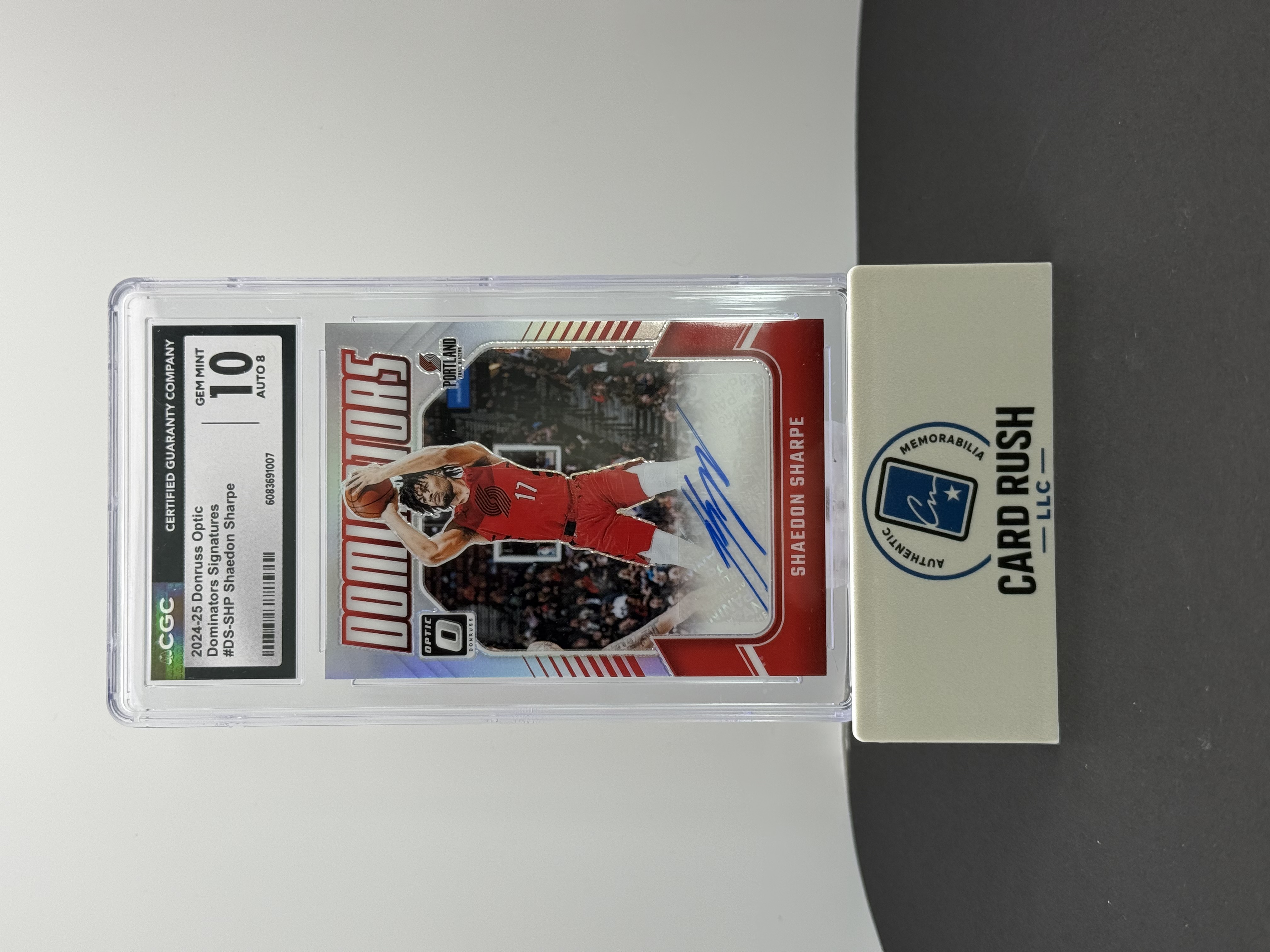 2024-25 Panini Donruss Optic Shaedon Sharpe Dominators Red 40/99 Auto CGC GM 10, front